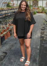 Women’s black oversized tee and bike shorts 
